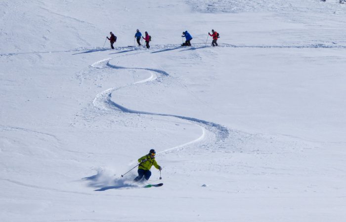 group of skiers off-piste