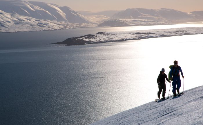 ski tourers in Norway at sunset