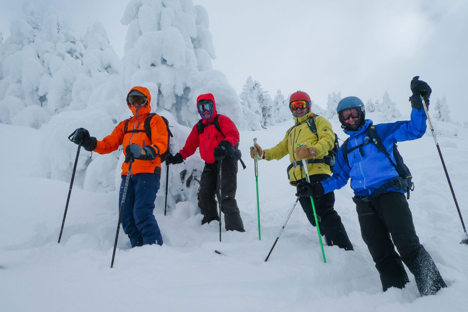 happy skiers in deep powder snow