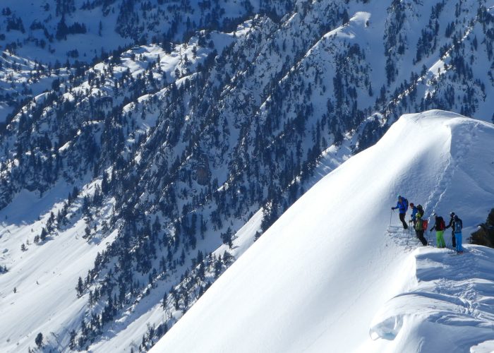 group of off piste skiers on mountain top
