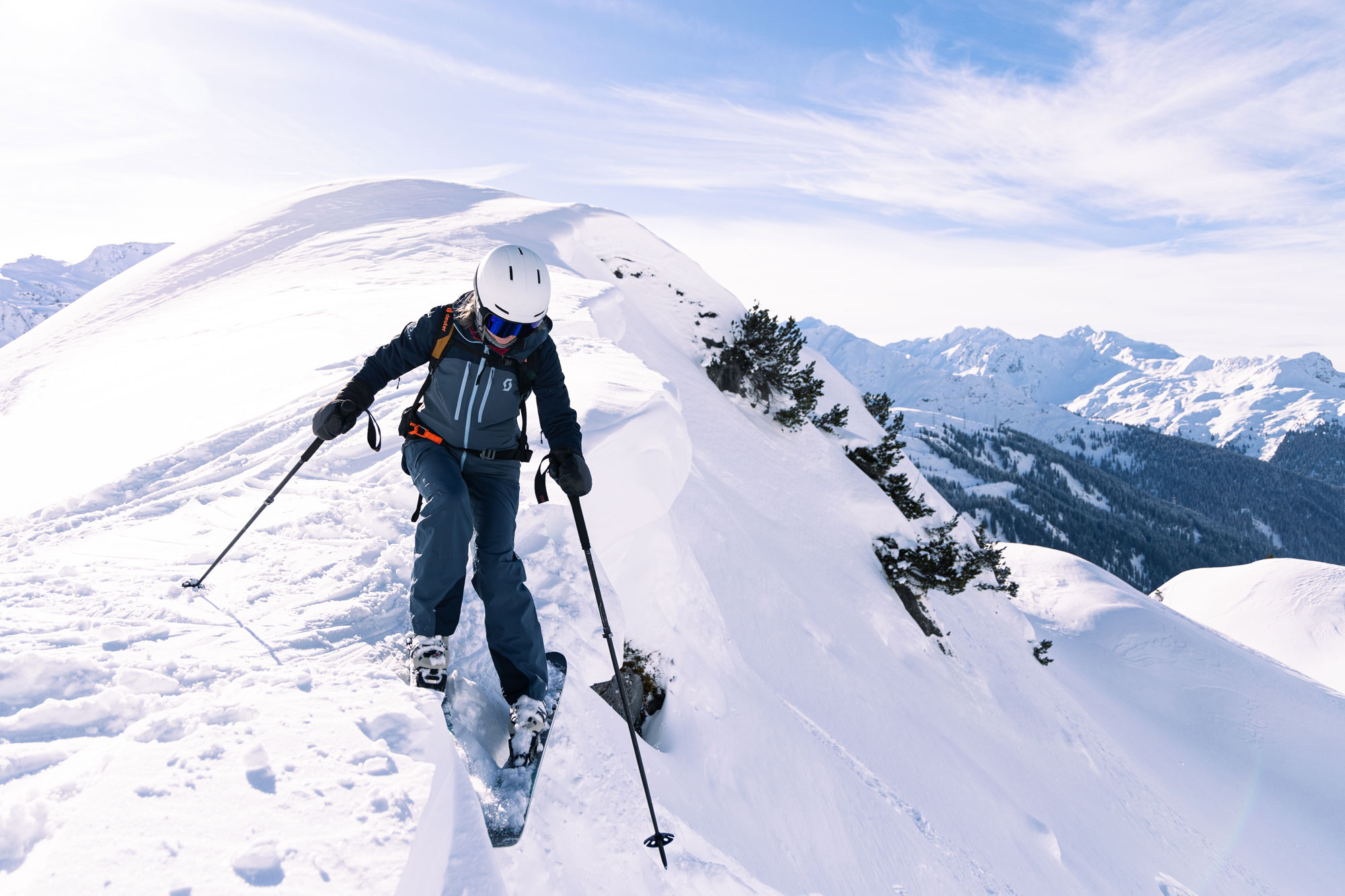 off-piste skier at top of mountain